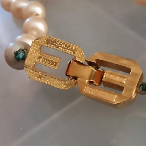 Givenchy pearl necklace with gold tone clasp.In Excellent Mint Unused Condition